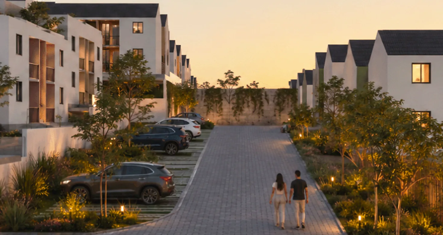 Rua da Linha City ao entardecer, com casas de telhado embutido e casal caminhando